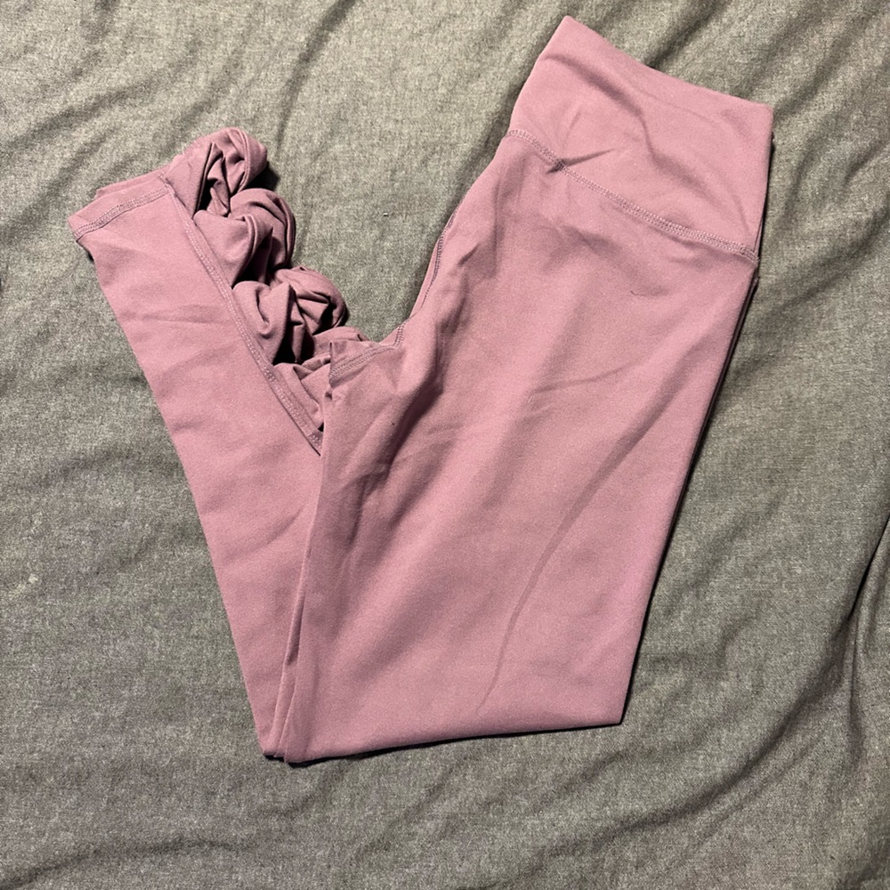 Never worn. Light purple leggings with detail at bottom